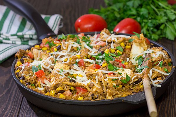 Looking for a fun way to mix up week night dinners?  Mix the burritos right into the filling with these tasty Skillet Beef Burritos!
