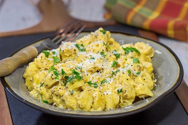 This Tortellini with Pumpkin Alfredo is creamy, delicious and so easy to make for a chilly Fall evening.  Make tonight a comfort food night!