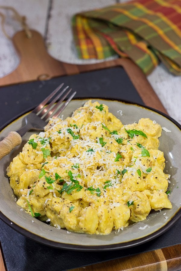 This Tortellini with Pumpkin Alfredo is creamy, delicious and so easy to make for a chilly Fall evening.  Make tonight a comfort food night!