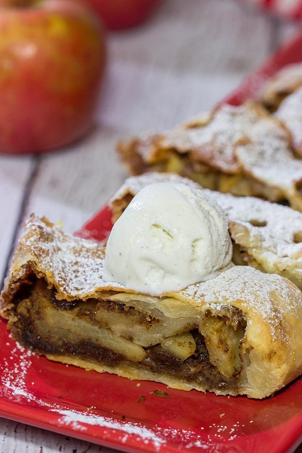 This classic Apple Strudel features crispy pastry dough filled with cinnamon, apples and rum-soaked raisins.  It's a delicious way to celebrate apple season!