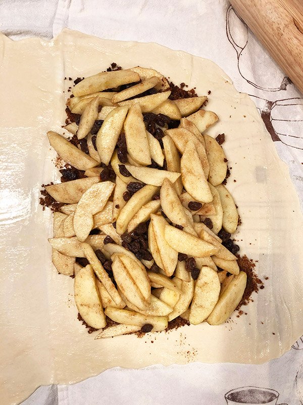 This classic Apple Strudel features crispy pastry dough filled with cinnamon, apples and rum-soaked raisins.  It's a delicious way to celebrate apple season!