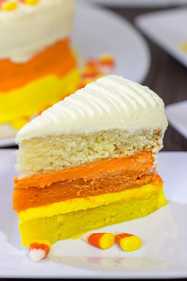 Whether you love or hate actual candy corn, this Candy Corn Cake is a delicious way to celebrate Halloween!  Happy baking!