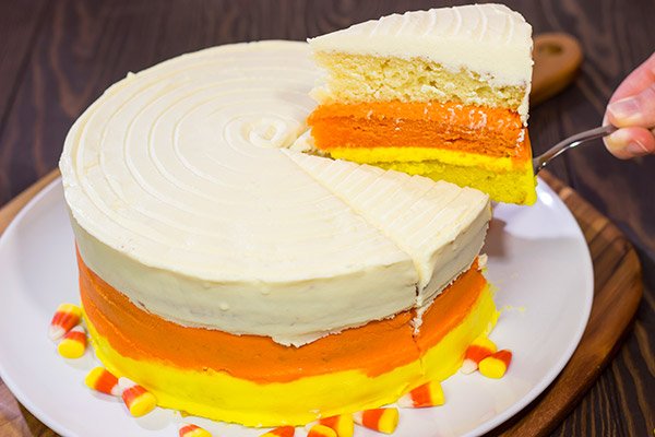 Whether you love or hate actual candy corn, this Candy Corn Cake is a delicious way to celebrate Halloween!  Happy baking!