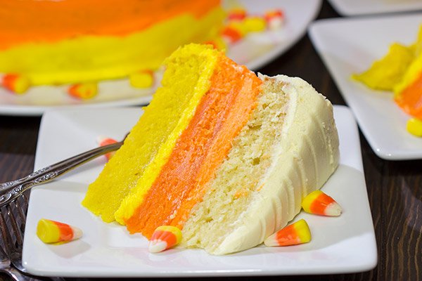 Whether you love or hate actual candy corn, this Candy Corn Cake is a delicious way to celebrate Halloween!  Happy baking!