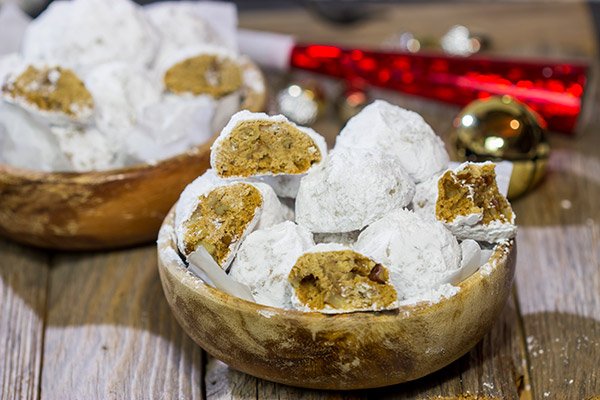 These Gingerbread Snowball Cookies are what happens when you throw snowballs at gingerbread cookies.  They're a delicious combination of two favorite holiday cookies!