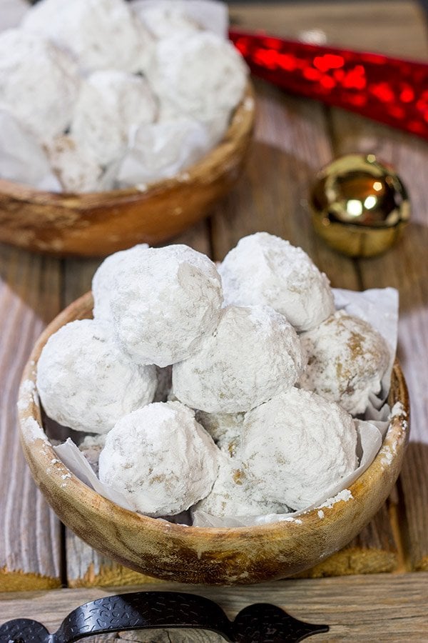 These Gingerbread Snowball Cookies are what happens when you throw snowballs at gingerbread cookies.  They're a delicious combination of two favorite holiday cookies!