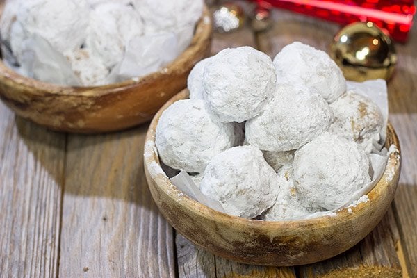 These Gingerbread Snowball Cookies are what happens when you throw snowballs at gingerbread cookies.  They're a delicious combination of two favorite holiday cookies!