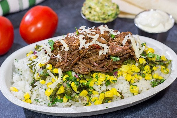 Craving some delicious comfort food?  Then put these Slow Cooker Beef Barbacoa Burrito Bowls on the menu!