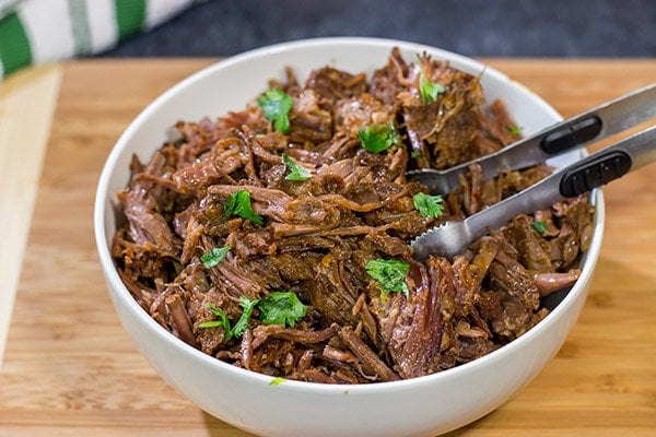 Craving some delicious comfort food?  Then put these Slow Cooker Beef Barbacoa Burrito Bowls on the menu!