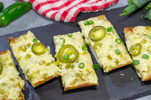 Topped with 2 types of cheese, this Cheesy Jalapeno Garlic Bread makes for a delicious addition to any meal!