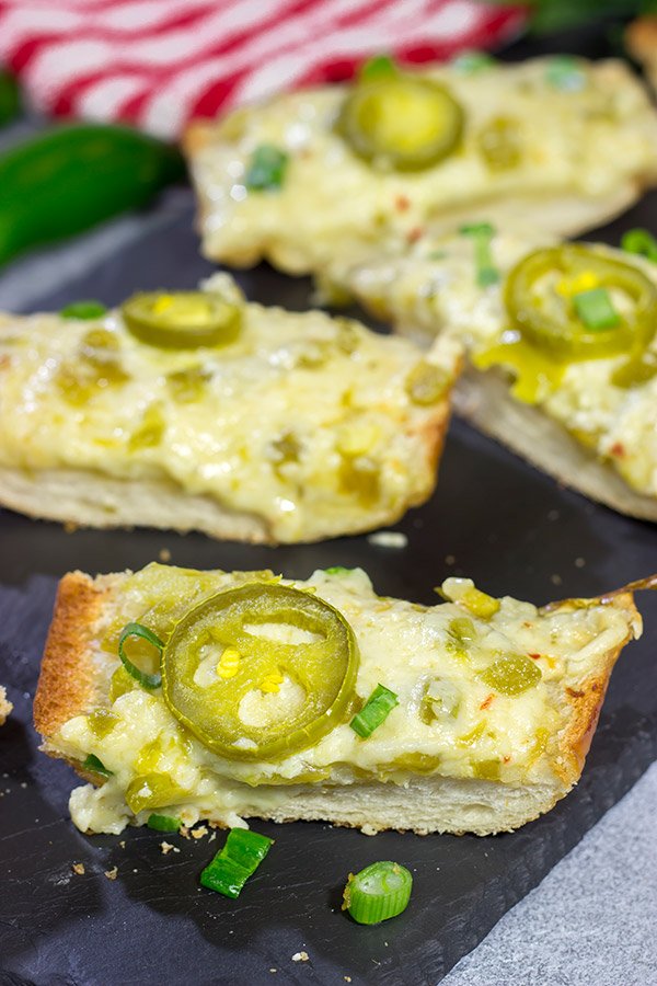 Topped with 2 types of cheese, this Cheesy Jalapeno Garlic Bread makes for a delicious addition to any meal!