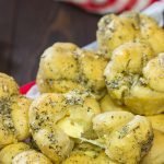 Take a good garlic knot and make it better...by adding cheese!  These Cheesy Muffin Tin Garlic Knots are a fun and tasty snack.  They're sure to become a family favorite!