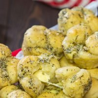 Take a good garlic knot and make it better...by adding cheese!  These Cheesy Muffin Tin Garlic Knots are a fun and tasty snack.  They're sure to become a family favorite!