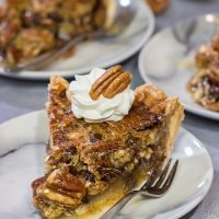 The traditional pecan pie gets a makeover in the form of this Chocolate Bourbon Pecan Pie. It's a fun and delicious twist on a classic recipe. Bake one up for dessert today!