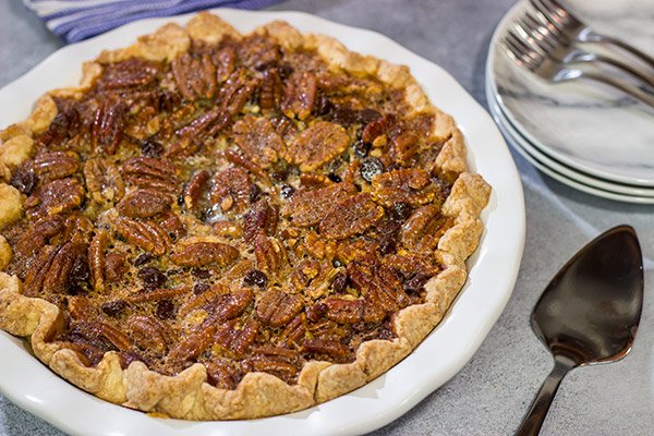 The traditional pecan pie gets a makeover in the form of this Chocolate Bourbon Pecan Pie.  It's a fun and delicious twist on a classic recipe.  Bake one up for dessert today!