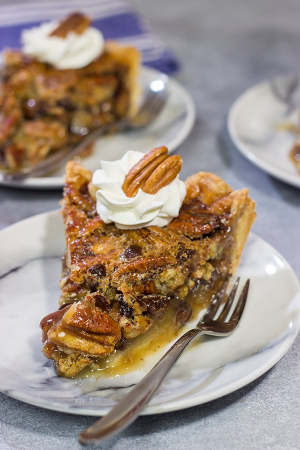 The traditional pecan pie gets a makeover in the form of this Chocolate Bourbon Pecan Pie.  It's a fun and delicious twist on a classic recipe.  Bake one up for dessert today!
