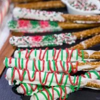 These Christmas Pretzel Rods are a festive and easy snack or dessert for the holidays! They're fun for little kids, and they also make great neighbor and teacher gifts!