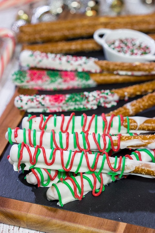 These Christmas Pretzel Rods are a festive and easy snack or dessert for the holidays! They're fun for little kids, and they also make great neighbor and teacher gifts!