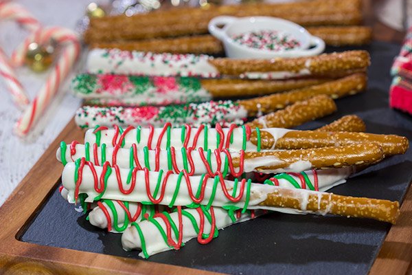 These Christmas Pretzel Rods are a festive and easy snack or dessert for the holidays!  They're fun for little kids, and they also make great neighbor and teacher gifts!