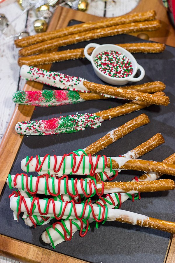 These Christmas Pretzel Rods are a festive and easy snack or dessert for the holidays!  They're fun for little kids, and they also make great neighbor and teacher gifts!