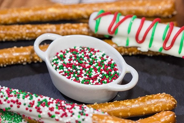 These Christmas Pretzel Rods are a festive and easy snack or dessert for the holidays!  They're fun for little kids, and they also make great neighbor and teacher gifts!