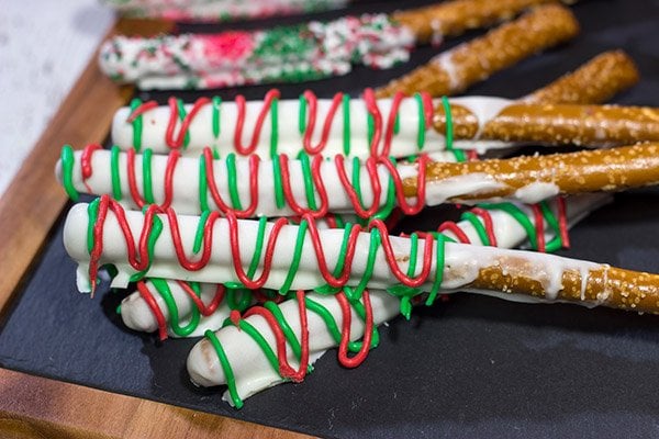 These Christmas Pretzel Rods are a festive and easy snack or dessert for the holidays!  They're fun for little kids, and they also make great neighbor and teacher gifts!