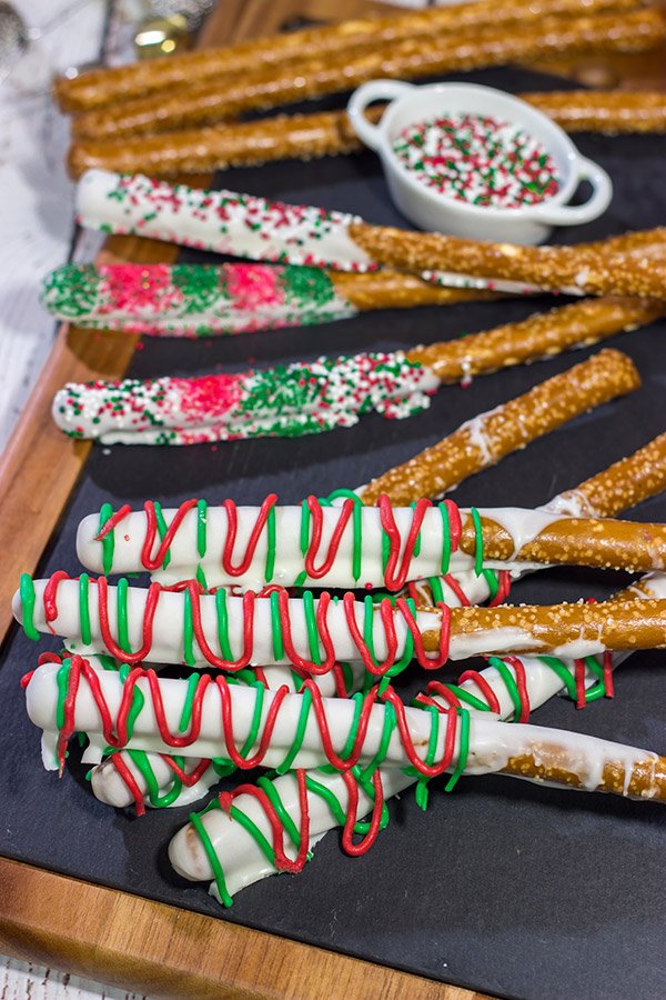 These Christmas Pretzel Rods are a festive and easy snack or dessert for the holidays!  They're fun for little kids, and they also make great neighbor and teacher gifts!