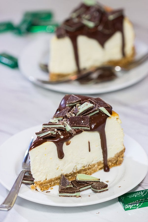 Topped with melted chocolate and chopped Andes mints, this Ricotta Cheesecake with Peppermint Chocolate Sauce is a delicious and fun holiday dessert!