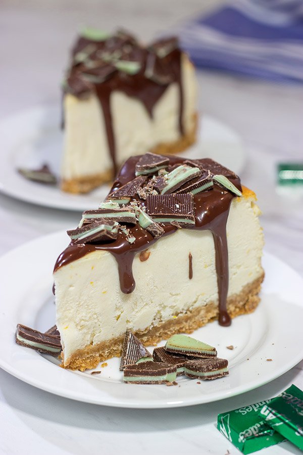Topped with melted chocolate and chopped Andes mints, this Ricotta Cheesecake with Peppermint Chocolate Sauce is a delicious and fun holiday dessert!