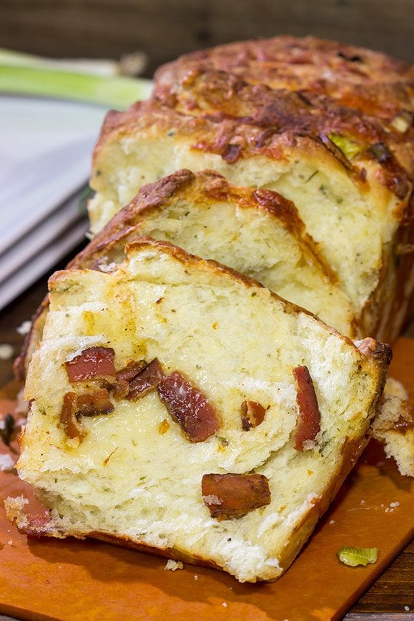 Looking for a fun homemade bread?  Try adding crispy bacon and melty cheese!  This Bacon Cheddar Pull Apart Bread not only smells great, but it tastes even better!