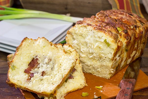 Looking for a fun homemade bread?  Try adding crispy bacon and melty cheese!  This Bacon Cheddar Pull Apart Bread not only smells great, but it tastes even better!