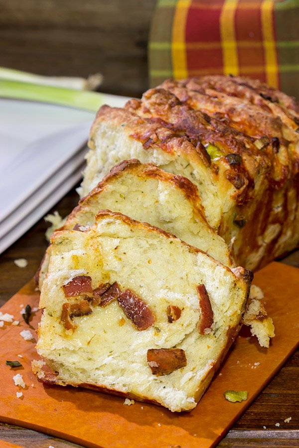 Looking for a fun homemade bread?  Try adding crispy bacon and melty cheese!  This Bacon Cheddar Pull Apart Bread not only smells great, but it tastes even better!