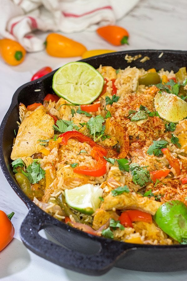 This Chicken Fajita Skillet is packed with flavor! It starts on the stove top and then finishes baking in the oven - this easy one-pan meal is perfect for weeknight cooking!