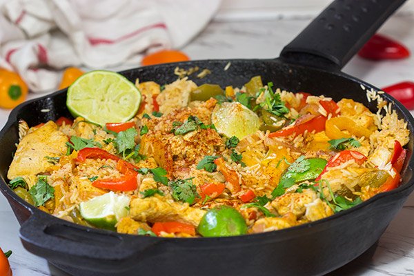 This Chicken Fajita Skillet is packed with flavor!  It starts on the stove top and then finishes baking in the oven - this easy one-pan meal is perfect for weeknight cooking!