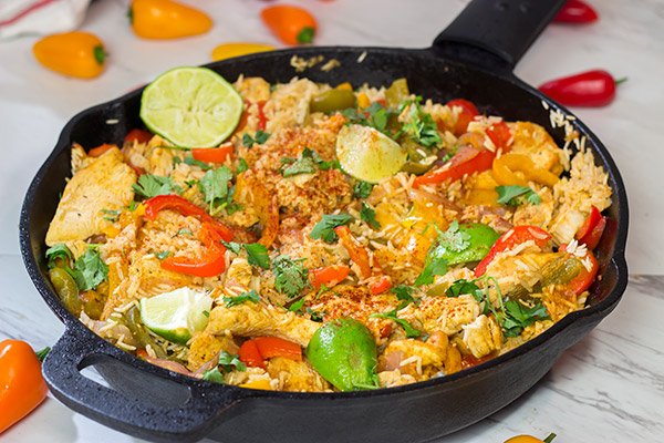 This Chicken Fajita Skillet is packed with flavor!  It starts on the stove top and then finishes baking in the oven - this easy one-pan meal is perfect for weeknight cooking!