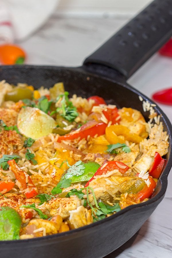This Chicken Fajita Skillet is packed with flavor!  It starts on the stove top and then finishes baking in the oven - this easy one-pan meal is perfect for weeknight cooking!