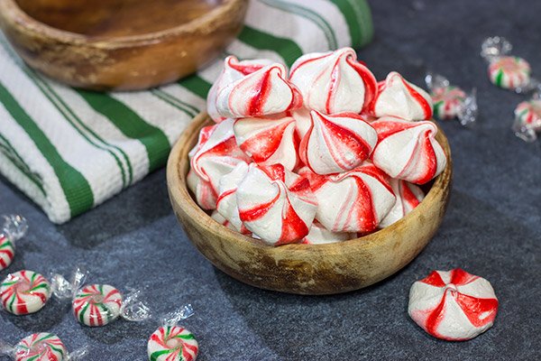 Add a festive touch to the holiday cookie tray with a batch of these Peppermint Meringues!  These light and airy treats are perfect for the holidays!