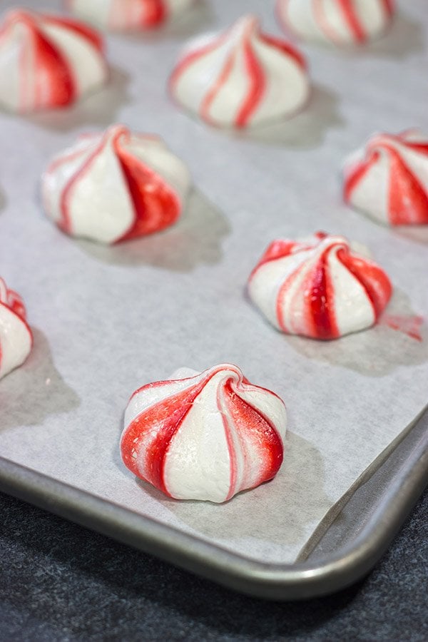 Add a festive touch to the holiday cookie tray with a batch of these Peppermint Meringues!  These light and airy treats are perfect for the holidays!