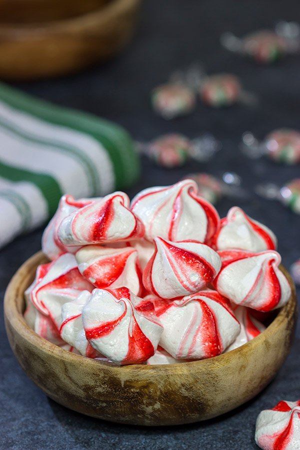 Add a festive touch to the holiday cookie tray with a batch of these Peppermint Meringues!  These light and airy treats are perfect for the holidays!