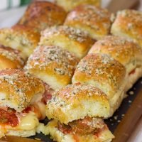 These Pull Apart Meatball Sliders are topped with garlic bread topping - they're a crowd-pleasing football appetizer!