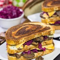 Get into the holiday spirit with this recipe for a Three Decker Toadstool and Sauerkraut Sandwich with Arsenic Sauce. Merry Grinchmas!