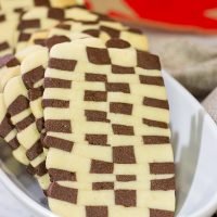 Featuring a fun "woven" look, these Basketweave Cookies are a delicious combination of vanilla and chocolate shortbread cookies. Bake up a batch today!