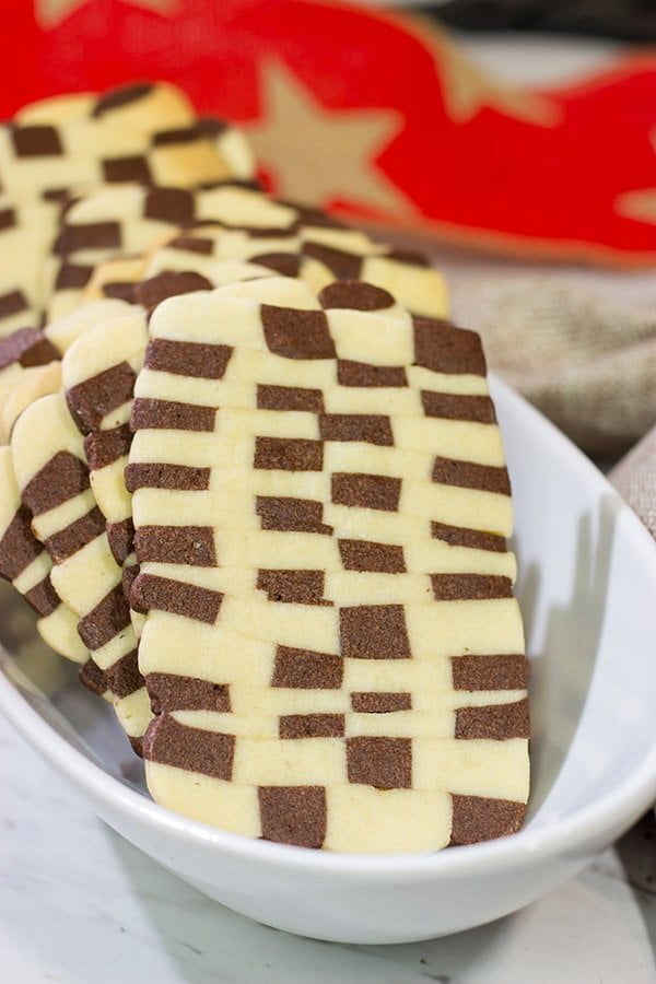 Featuring a fun "woven" look, these Basketweave Cookies are a delicious combination of vanilla and chocolate shortbread cookies.  Bake up a batch today!