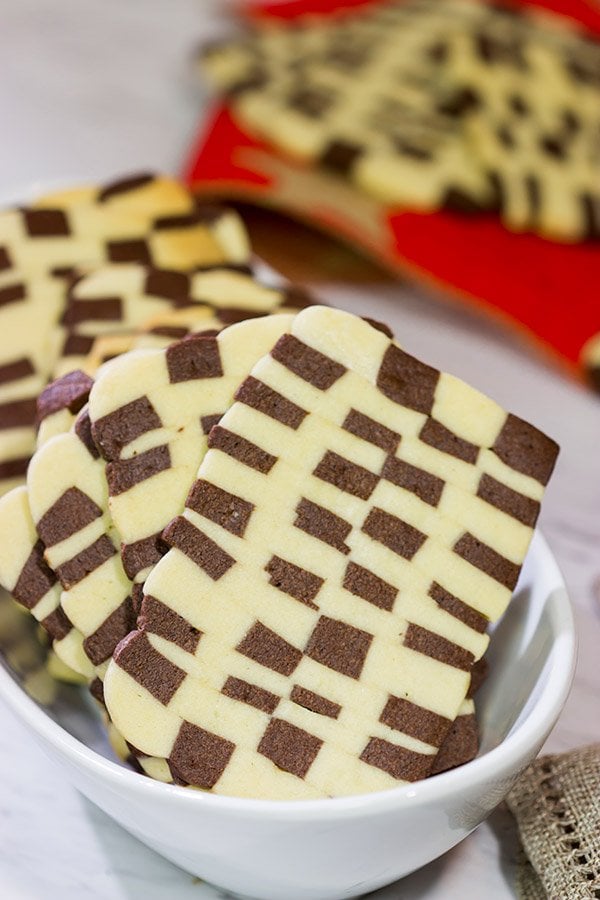 Featuring a fun "woven" look, these Basketweave Cookies are a delicious combination of vanilla and chocolate shortbread cookies.  Bake up a batch today!