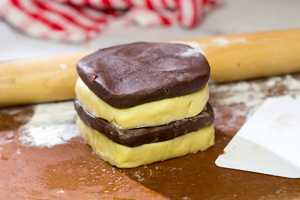 Featuring a fun "woven" look, these Basketweave Cookies are a delicious combination of vanilla and chocolate shortbread cookies.  Bake up a batch today!