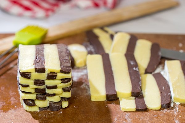 Featuring a fun "woven" look, these Basketweave Cookies are a delicious combination of vanilla and chocolate shortbread cookies.  Bake up a batch today!