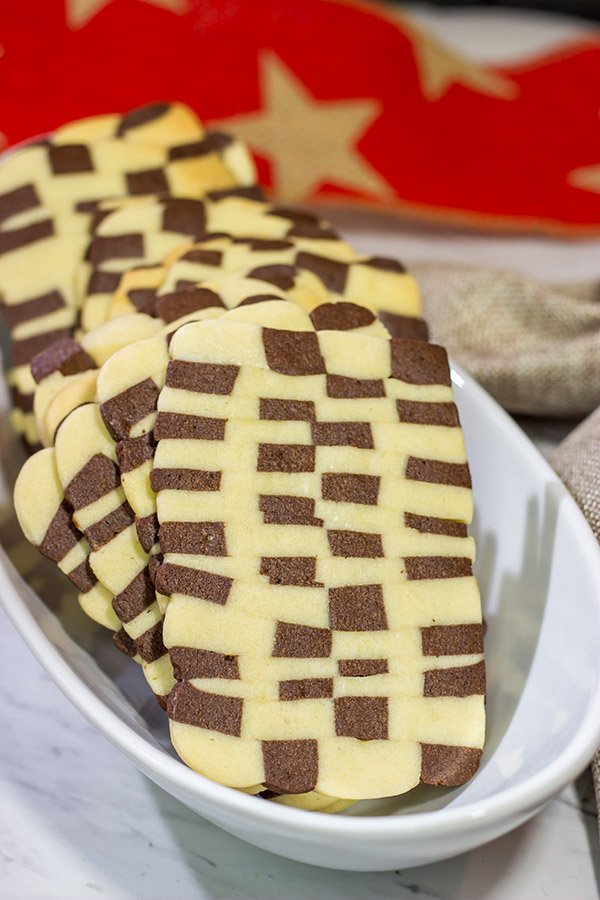Featuring a fun "woven" look, these Basketweave Cookies are a delicious combination of vanilla and chocolate shortbread cookies.  Bake up a batch today!
