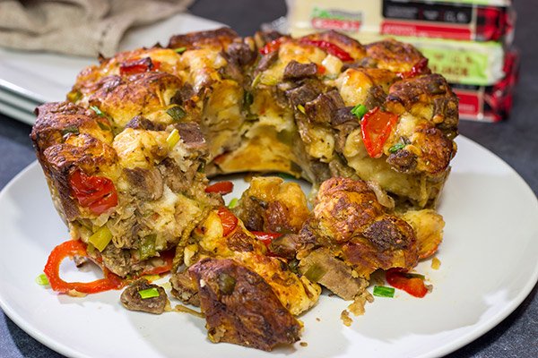 Packed with juicy steak, sauteed peppers + onions and two types of cheese, this Philly Cheesesteak Monkey Bread is one delicious way to mix up the routine!