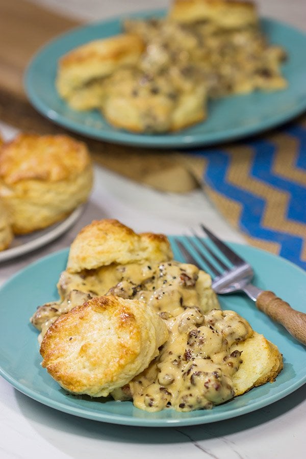 Homemade Buttermilk Biscuits and Sausage Gravy are an iconic Southern comfort food. Whip up a batch for brunch this weekend!