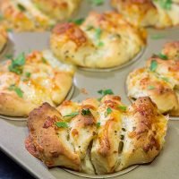Half pull-apart roll, half garlic knot, these Cheesy Garlic Butterflake Rolls are a fun and delicious way to add flavor to the dinner table. Bake up a batch today!